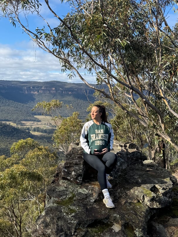 Jess resting on a nature walk. 