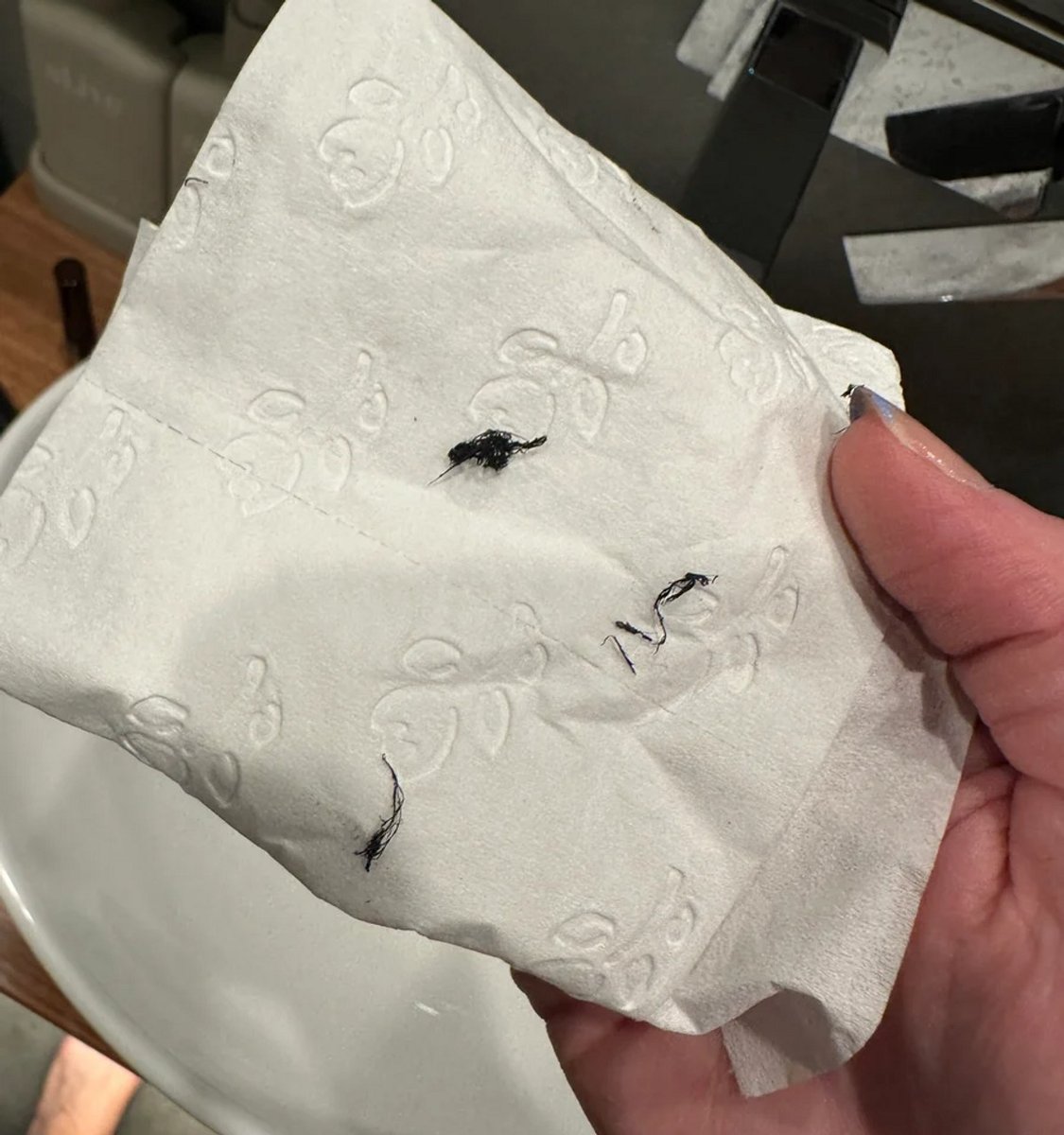 A tissue with brow tint on it.