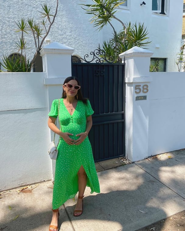 Writer wears a green tea dress.