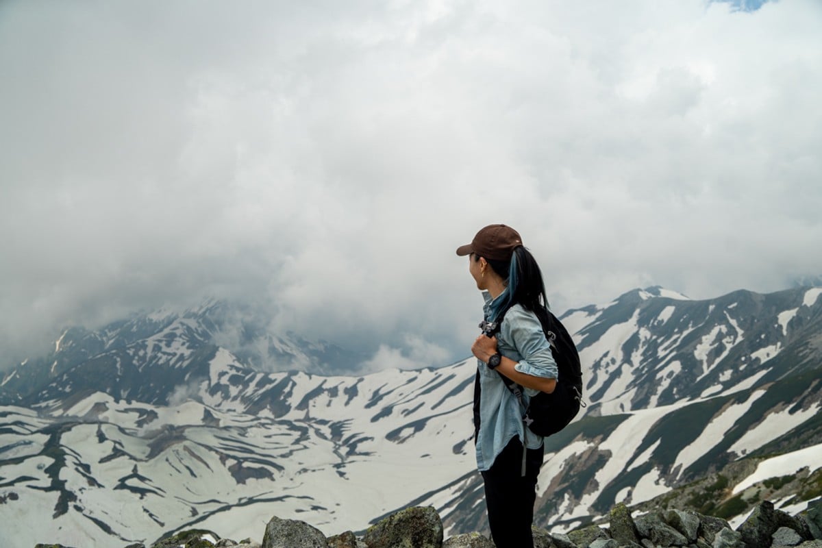 Zara standing on Mount Tate in Japan.
