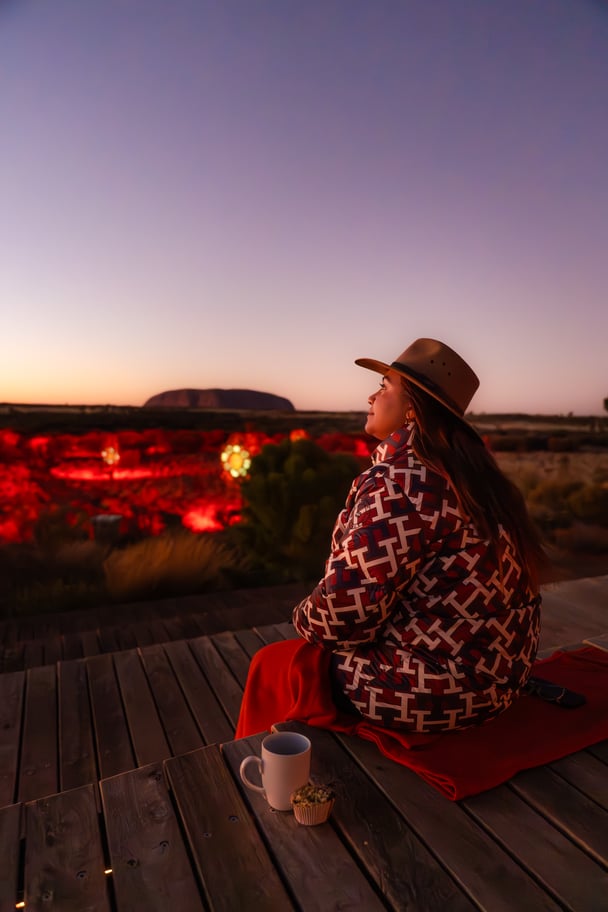 Jessica Mauboy watches an Uluru sunrise.