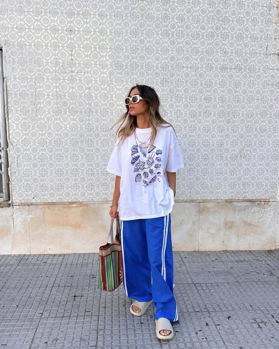 Byron Bay influencer Irene Sacristan pairs a boho tote with sporty separates.
