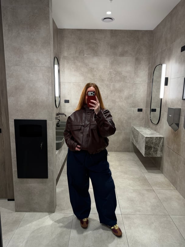 Amy Clark wearing target bomber leather jacket.