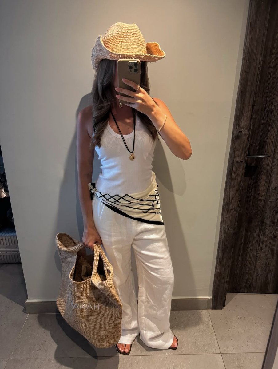 Influencer wears a printed scarf around their waist.