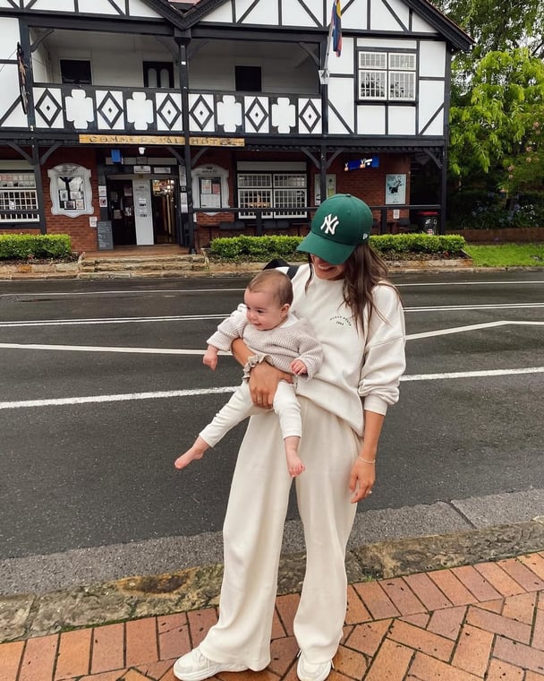 Author shares a photo of her everyday mum outfit featuring relaxed clothes.