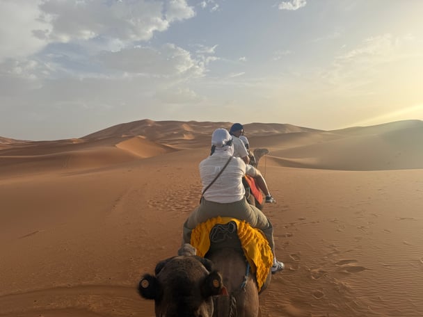 travelling to morocco camel ride sahara sand dunes