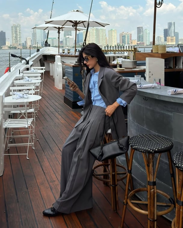 Fashionable workwear featuring a grey business suit and striped shirt.