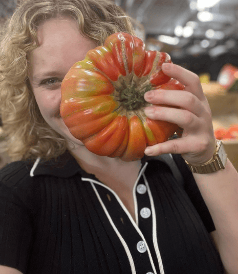 Raffaella Ciccarelli poses with food while grocery shopping.