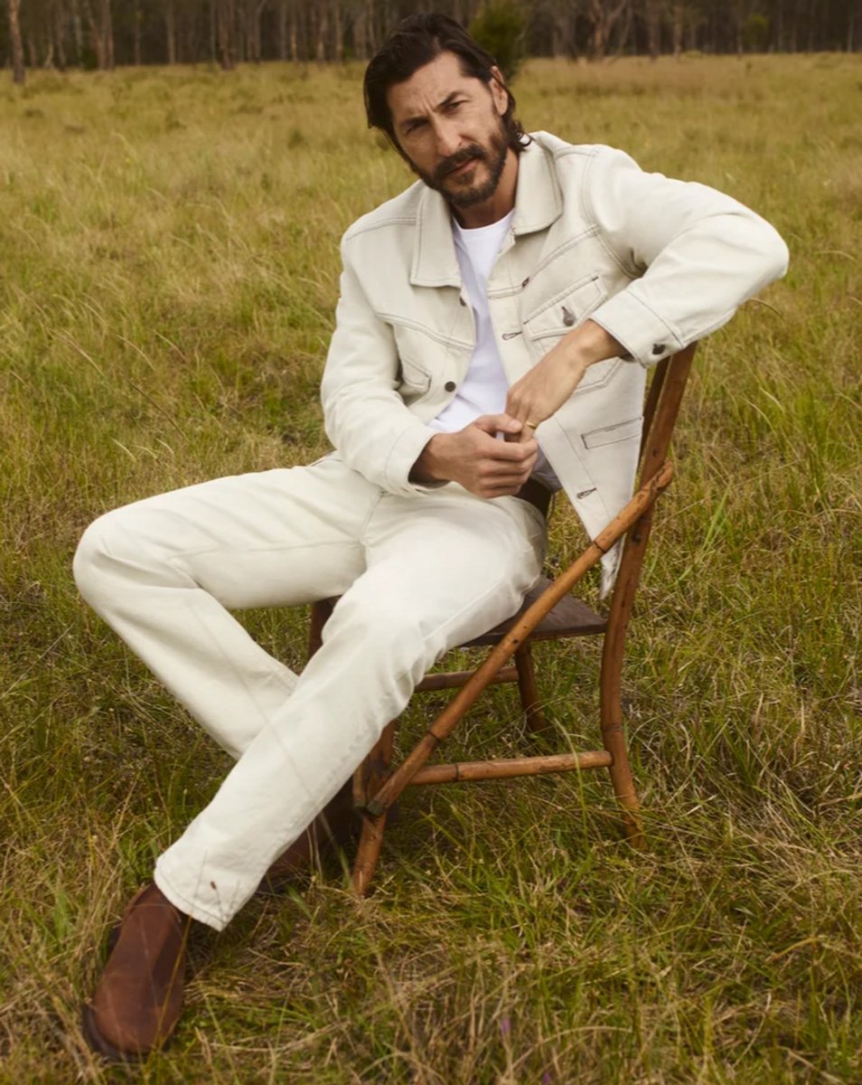 A man styles a monochrome black look with R.M.Williams boots.