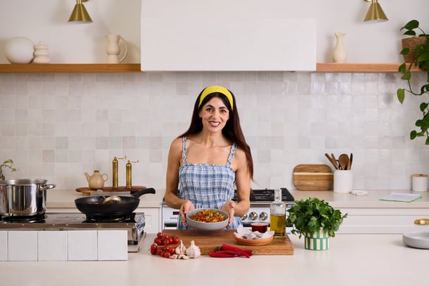 Silvia Colloca cooking in the kitchen.