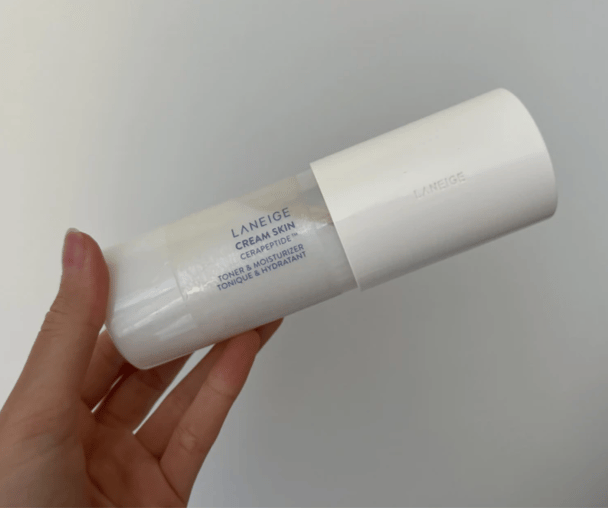 Woman's hand holding Laneige Cream Skin Cerapeptide Toner & Moisturiser