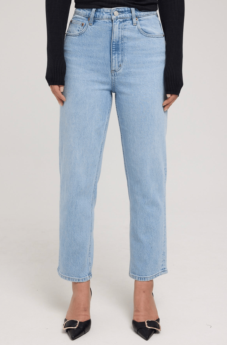 A pair of light blue cropped high waisted jeans by Lee.