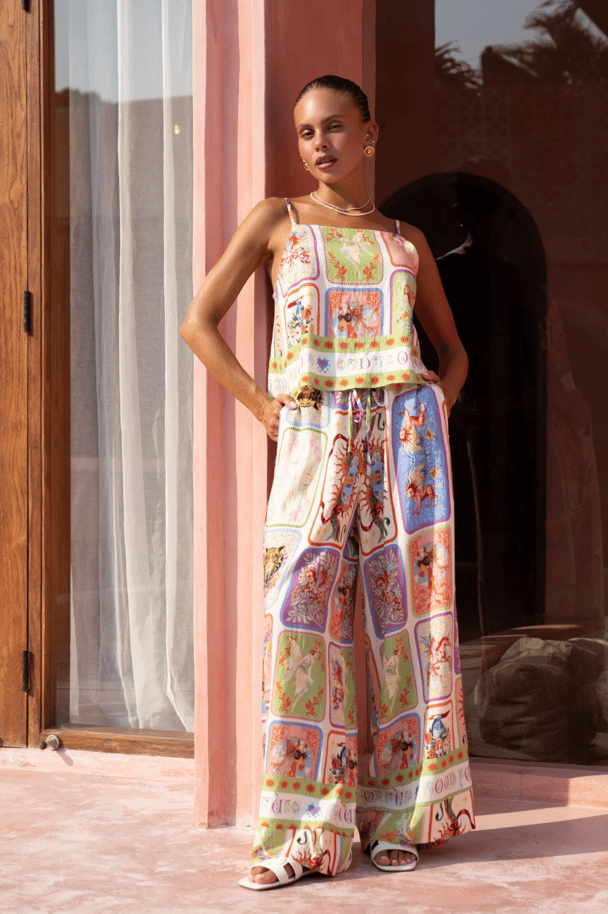 A printed cami top and matching palazzo pant in vibrant tarot card inspired motif.
