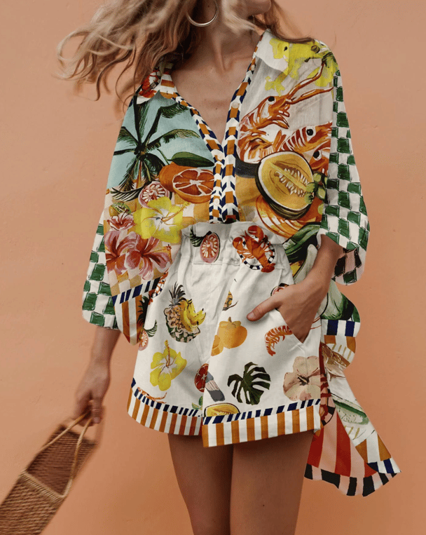 A printed smock-style shirt and matching shorts, in a vibrant tropical print.