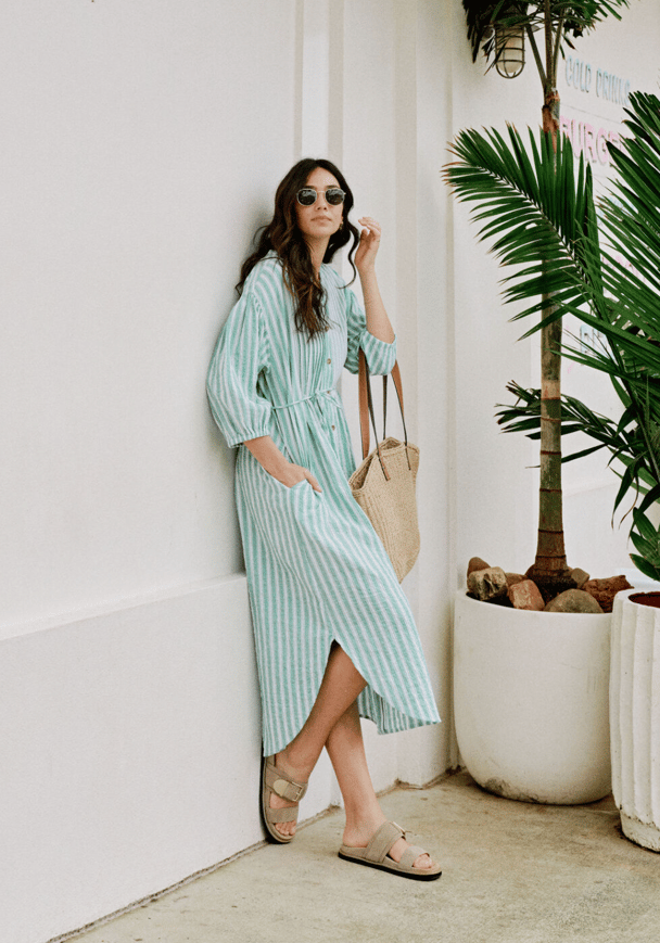 A green and white striped midi-dress with waist tie.