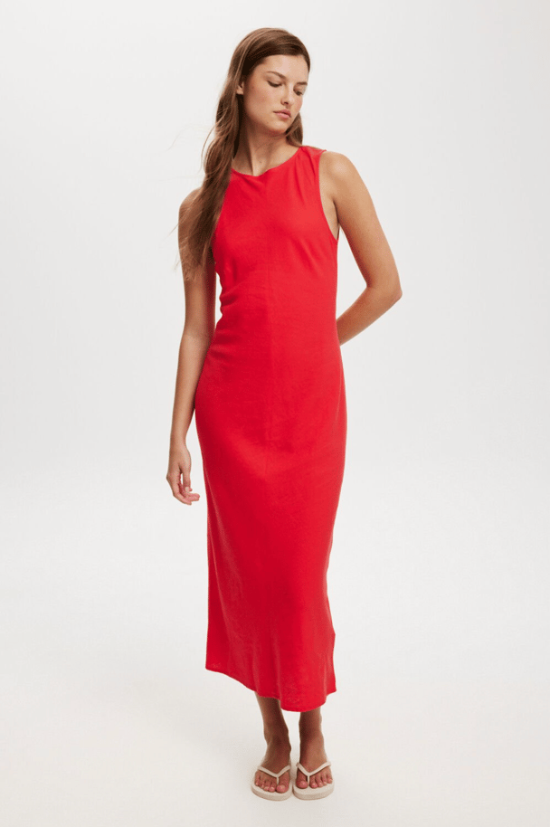A bright red, fitted, high neck midi dress.
