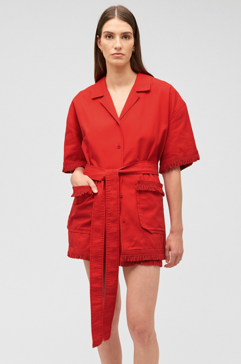 A boxy cut minidress with side pockets and a sash belt, in cherry red.