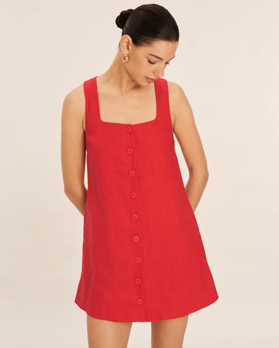 A cherry red button down linen minidress.