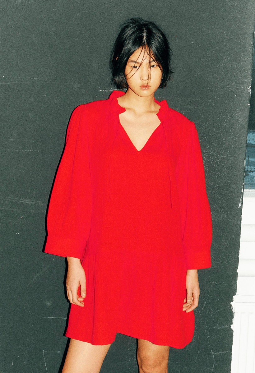 A bright red cotton smock dress.
