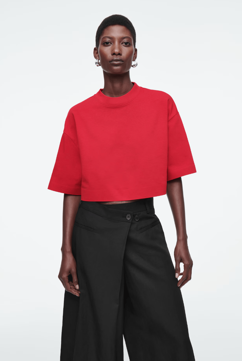 A cropped, high-neck, oversized t-shirt in cherry red.