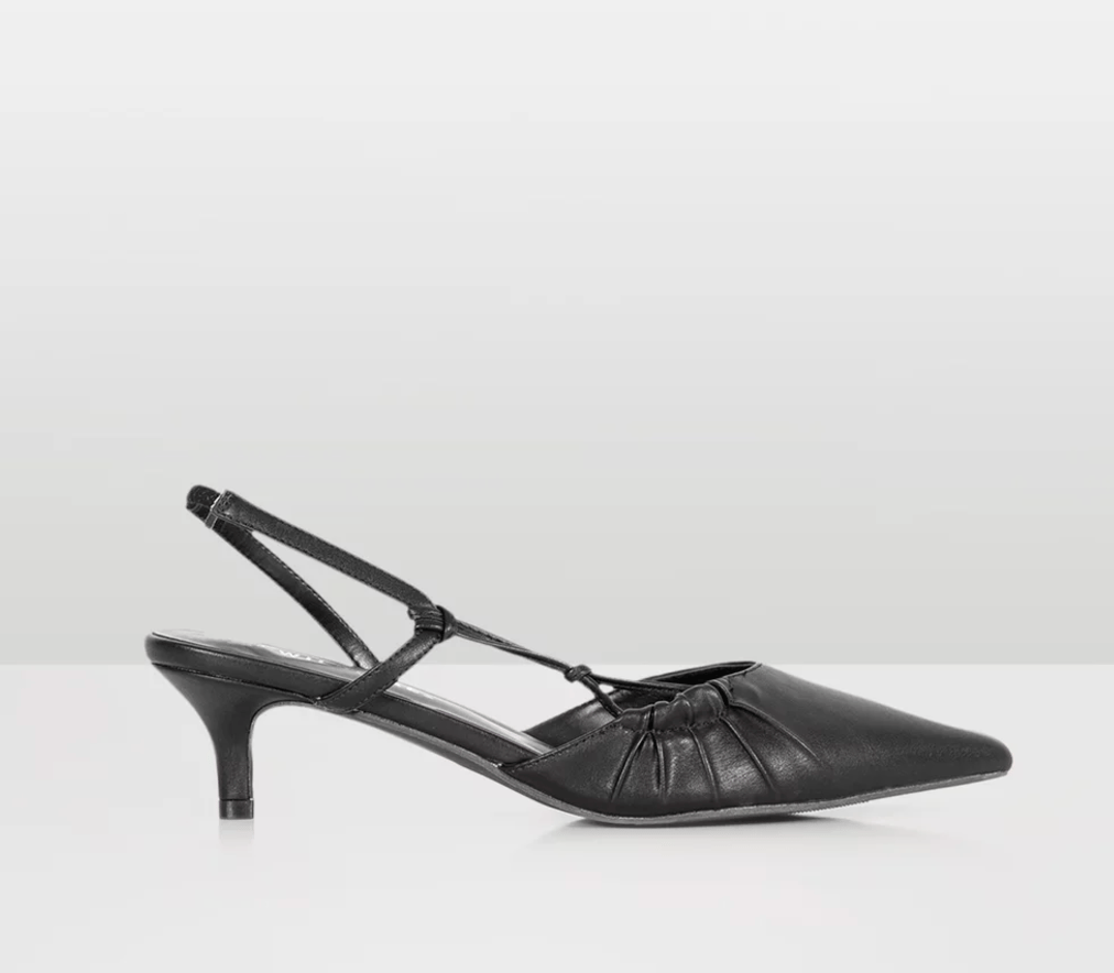 A black faux leather kitten heel pointy pump.