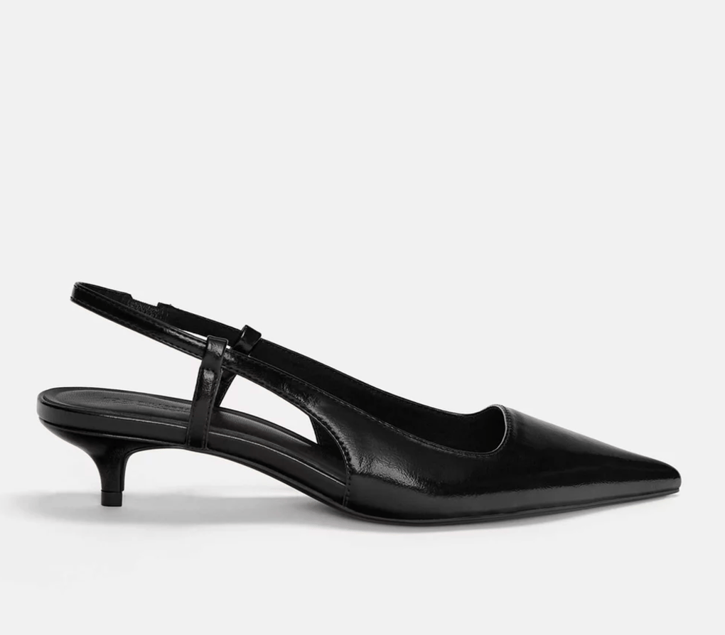 A black faux leather kitten heel pointy pump.