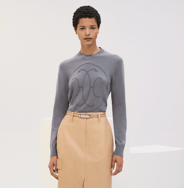 An embossed grey cashmere sweater by Hermes.