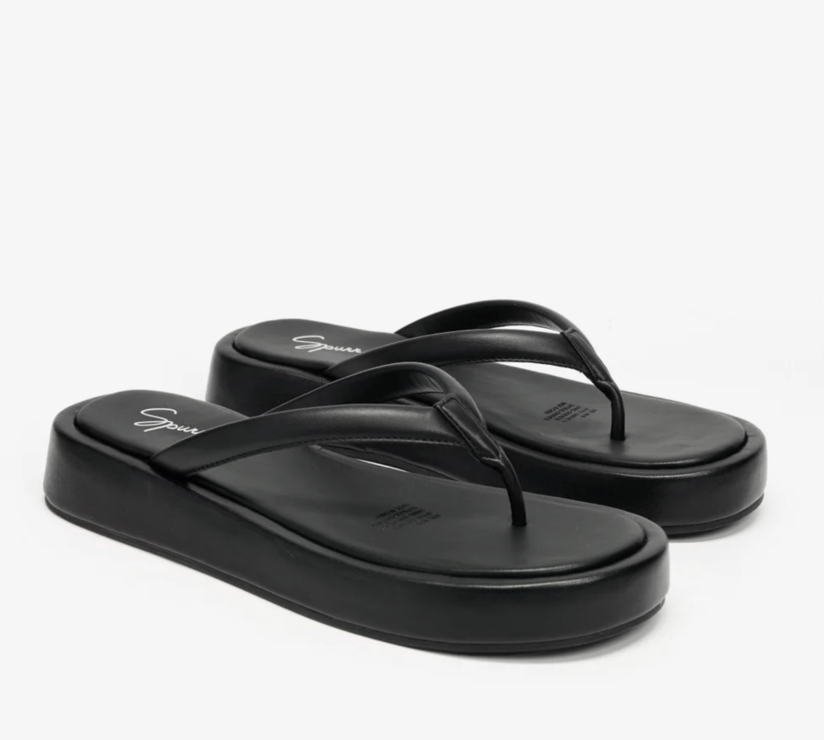 A pair of faux leather flatform thongs.