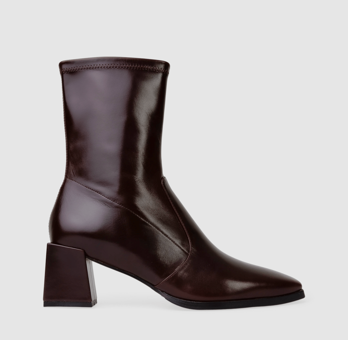 A burgundy patent leather boot.