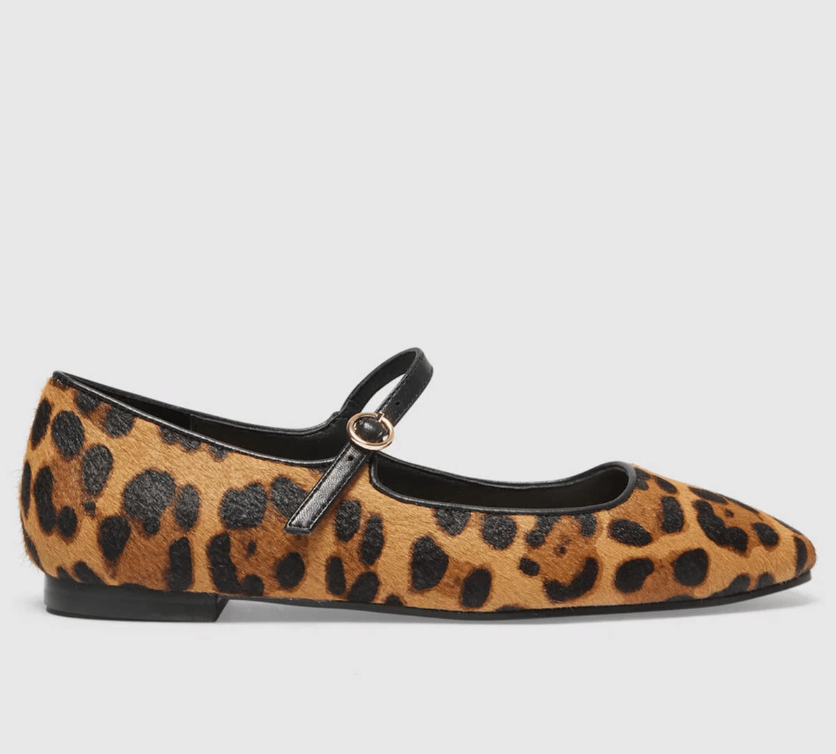 A leopard print ponyhair ballet flat with strap.