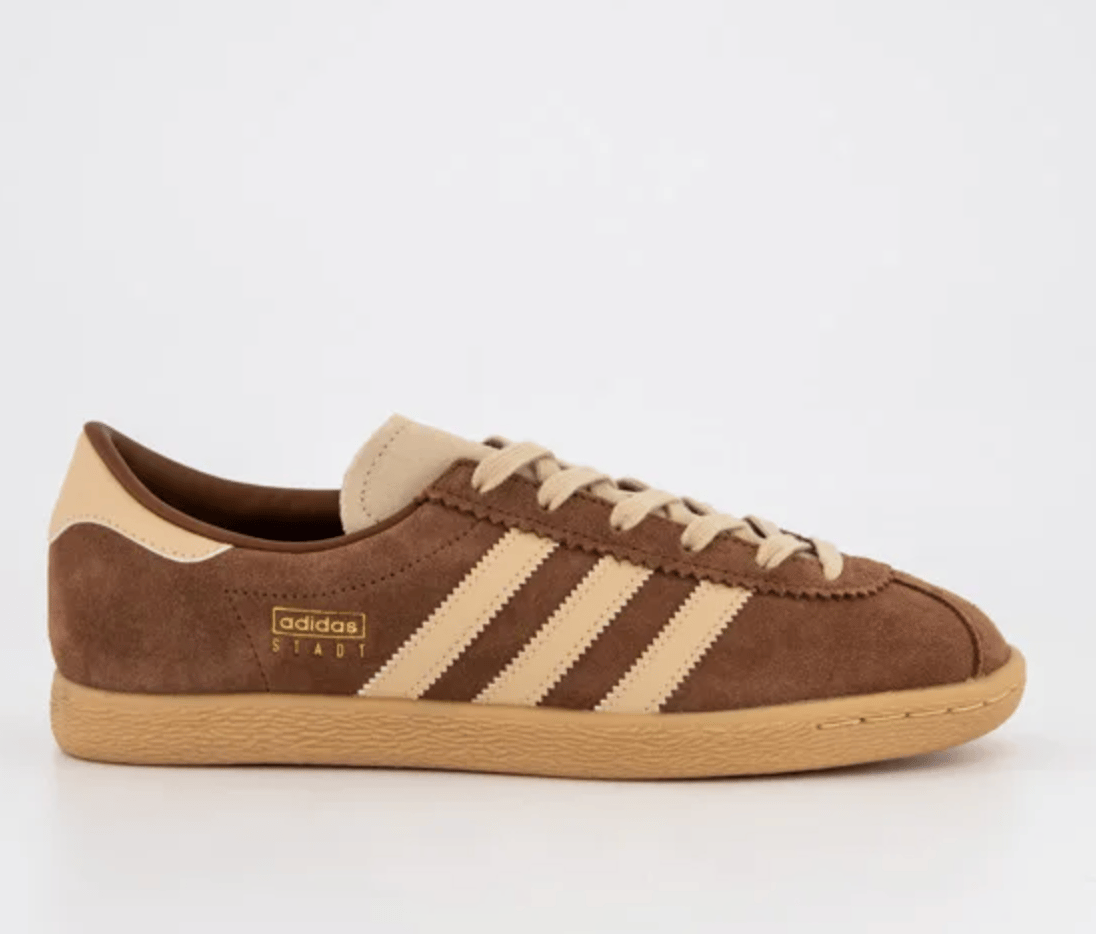 An Adidas Stadt sneaker in brown suede.