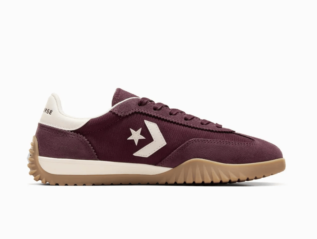 A burgundy Converse Run Star trainer.