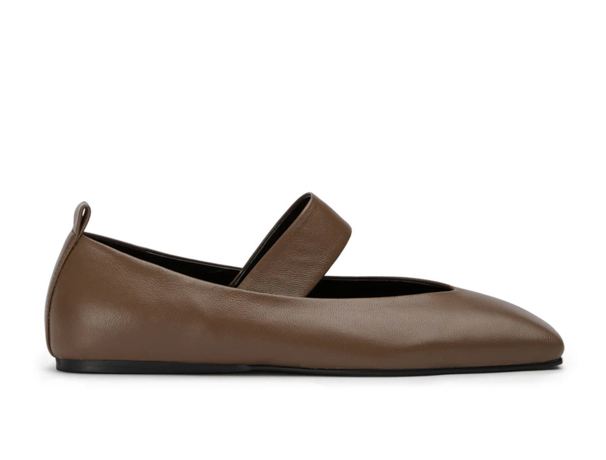 Fawn coloured leather ballet flats with elastic foot strap.