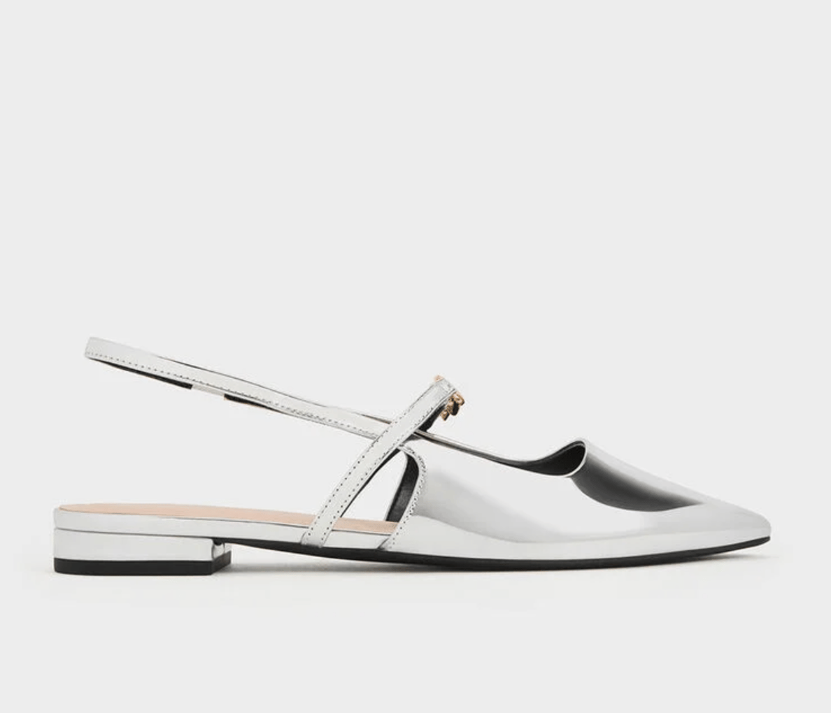 Silver pointed toe slingback flats.