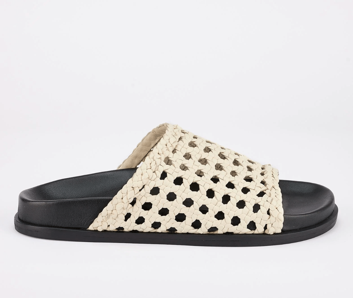 Flatform sandals with a white woven upper.