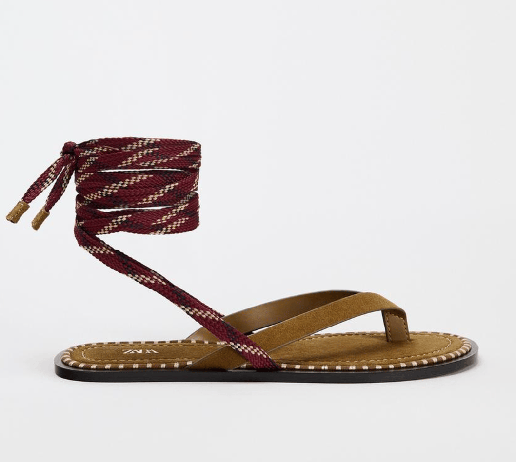 Lace-up thong sandals with rope ankle tie.