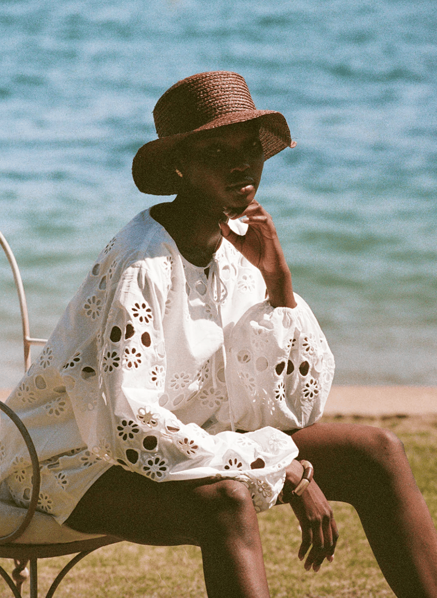 A white eyelet lace blouse.