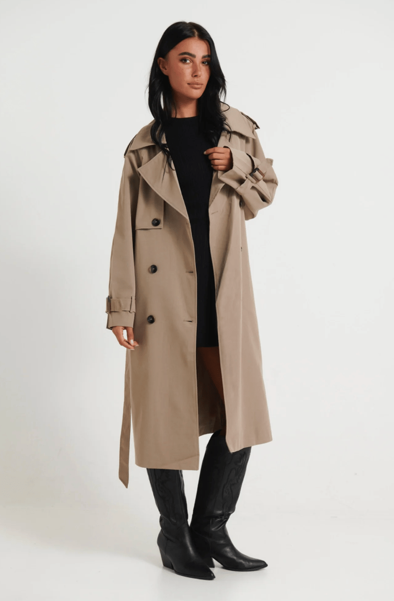 A fawn coloured oversized trench coat.