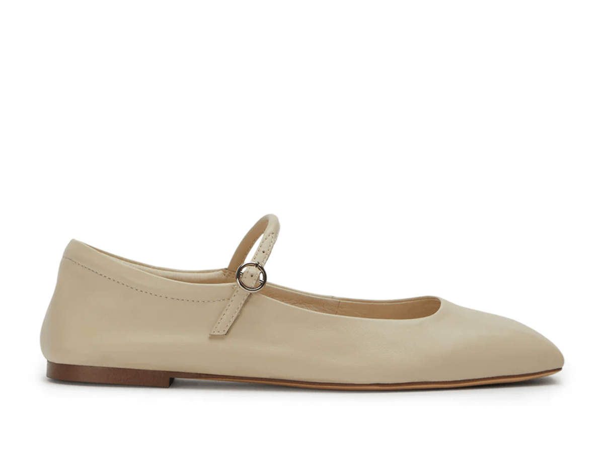 A taupe toned leather Mary Jane flat.