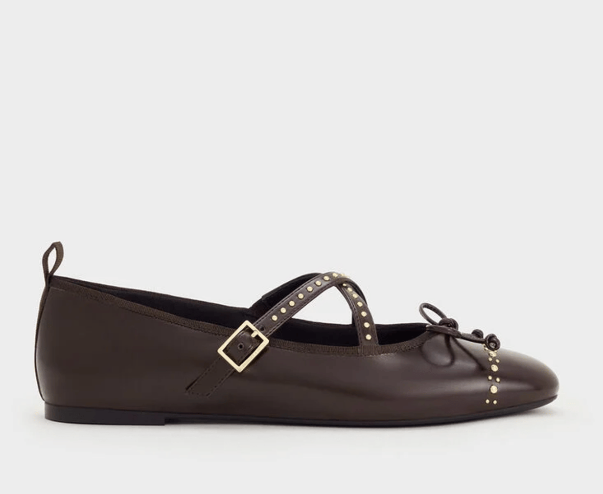 Chocolate brown Mary Jane ballet flats with gold detail.