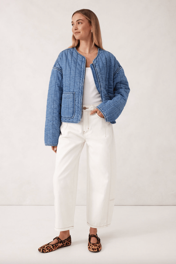 A quilted denim bomber jacket.