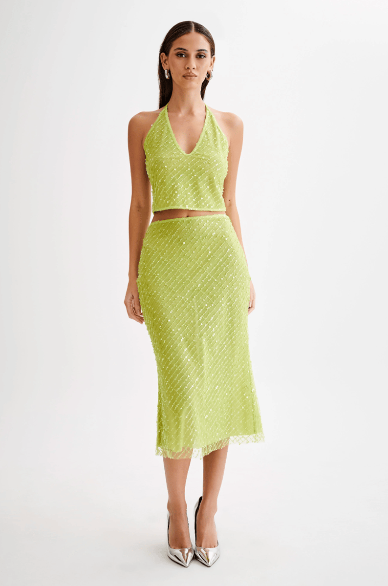 A lime green embellished midi skirt.