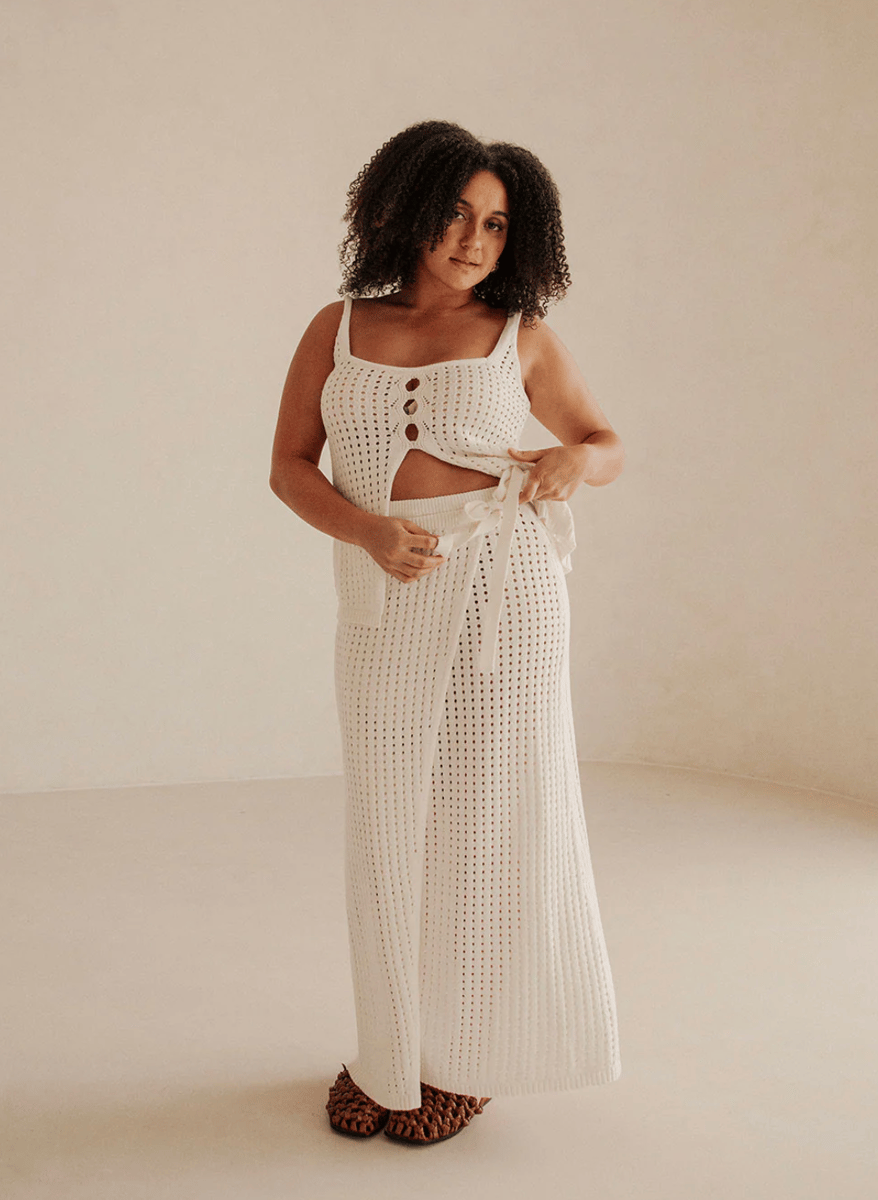 A white knitted wrap skirt.