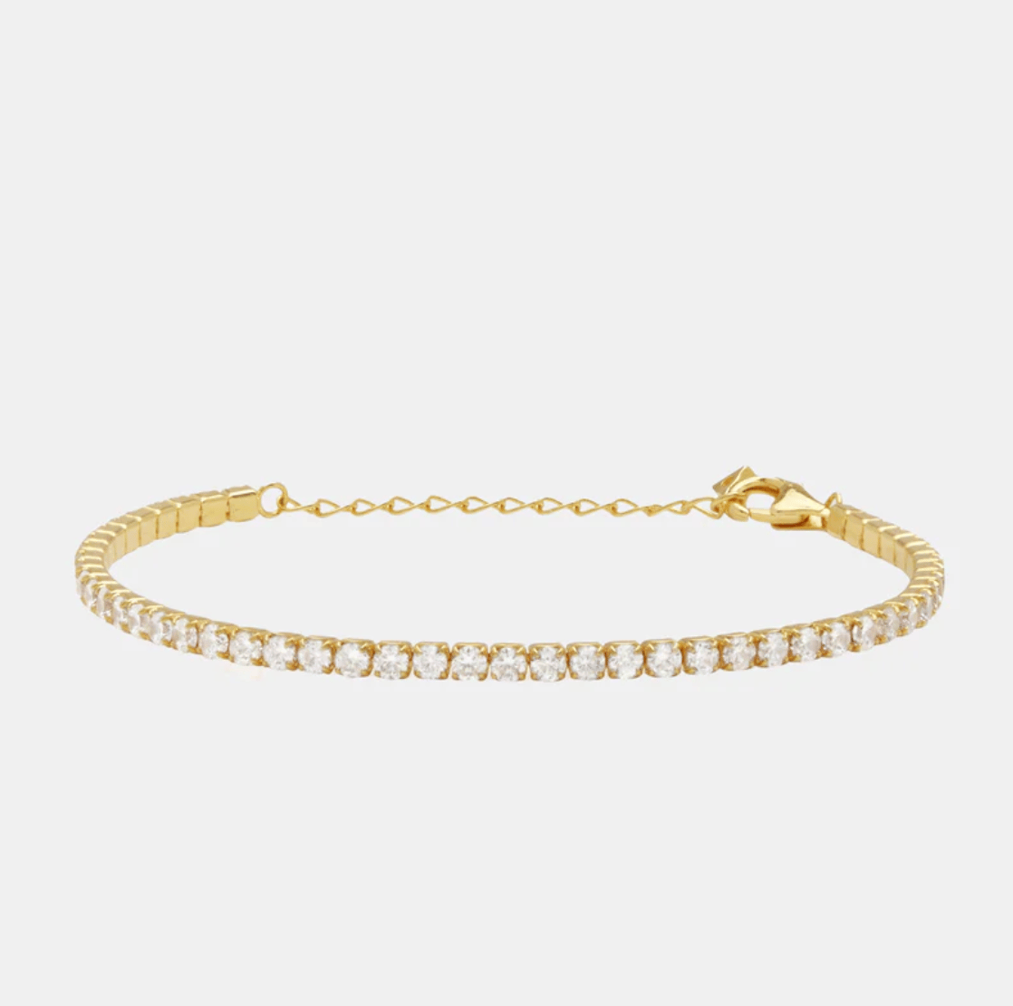 Gold tone tennis bracelet.