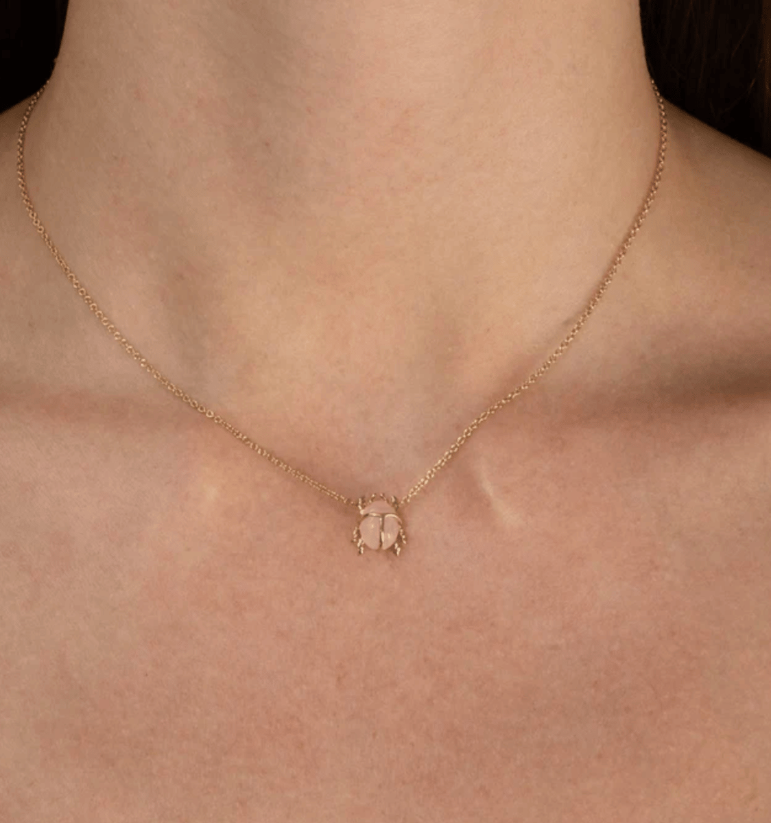 Rose quartz scarab beetle necklace.