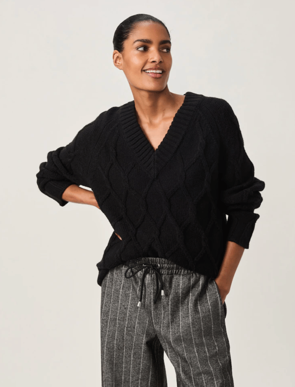 Black v-neck jumper.