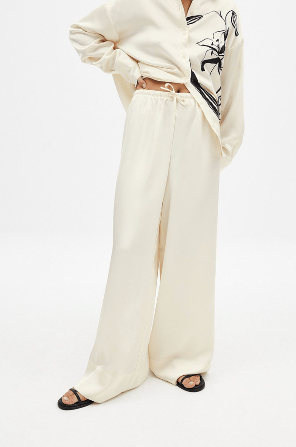 Cream satin pants.