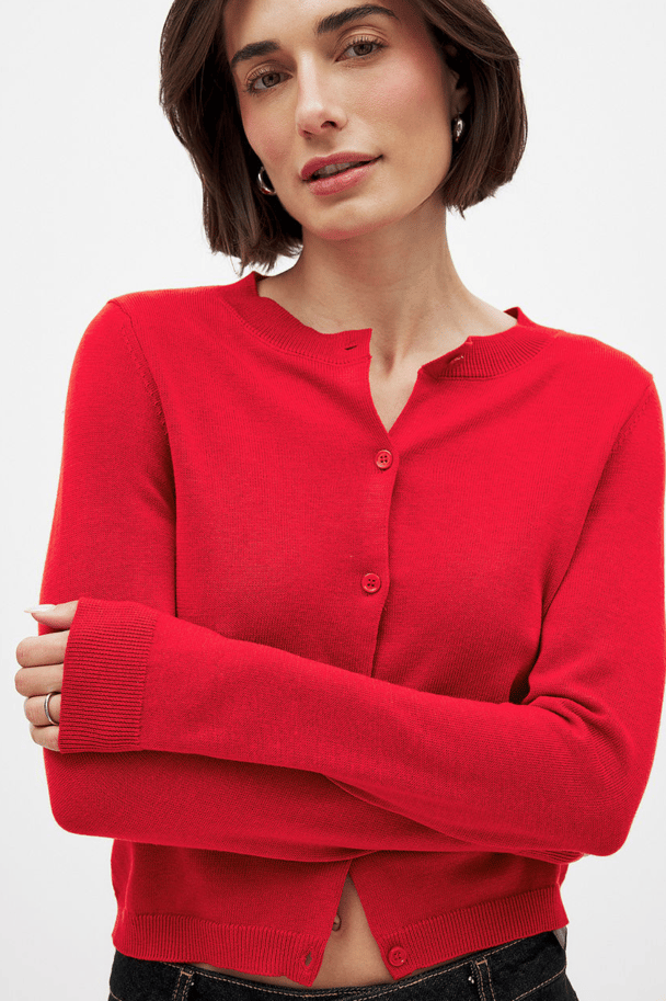 Red knitted cardigan.