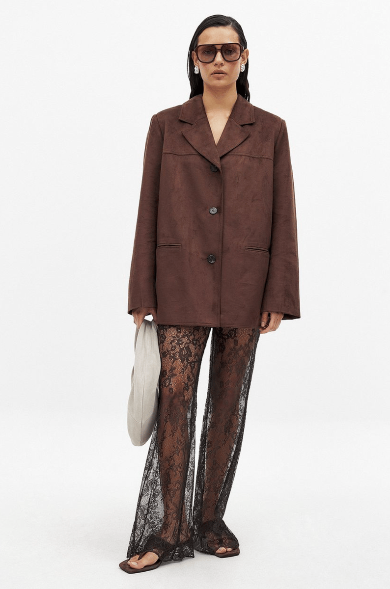 NA-KD brown lace trousers.
