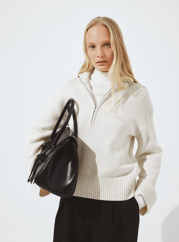 NA-KD zip neck sweater.